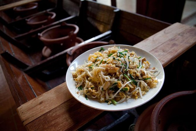 Chiang Mai Home Cooking Class with Garden Tour & Hotel Transfers - Eating what you cooked: family-table lunch, local beer, and dessert