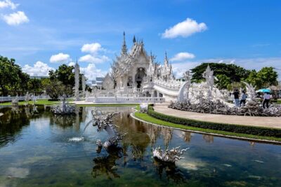 Chiang Rai Famed Temples and Golden Triangle Tour from Chiang Mai - Wat Rong Khun (White Temple): Art-Temple Energy With a Time Limit
