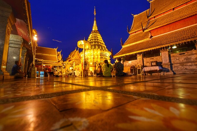 Doi Suthep and Wat Umong Night Tour From Chiang Mai - Wat Phrathat Doi Suthep after dark: 306 steps, Naga serpent, and gold details