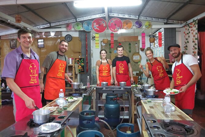Half-Day Thai Cooking Class and Market Tour From Chiang Mai - Inside the open-air kitchen: how the class actually feels