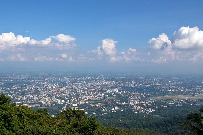 Wat Phra That Doi Suthep & Hmong Village Half Day Tour From Chiang Mai - Hmong Village visit: garments, daily life, and respectful interaction